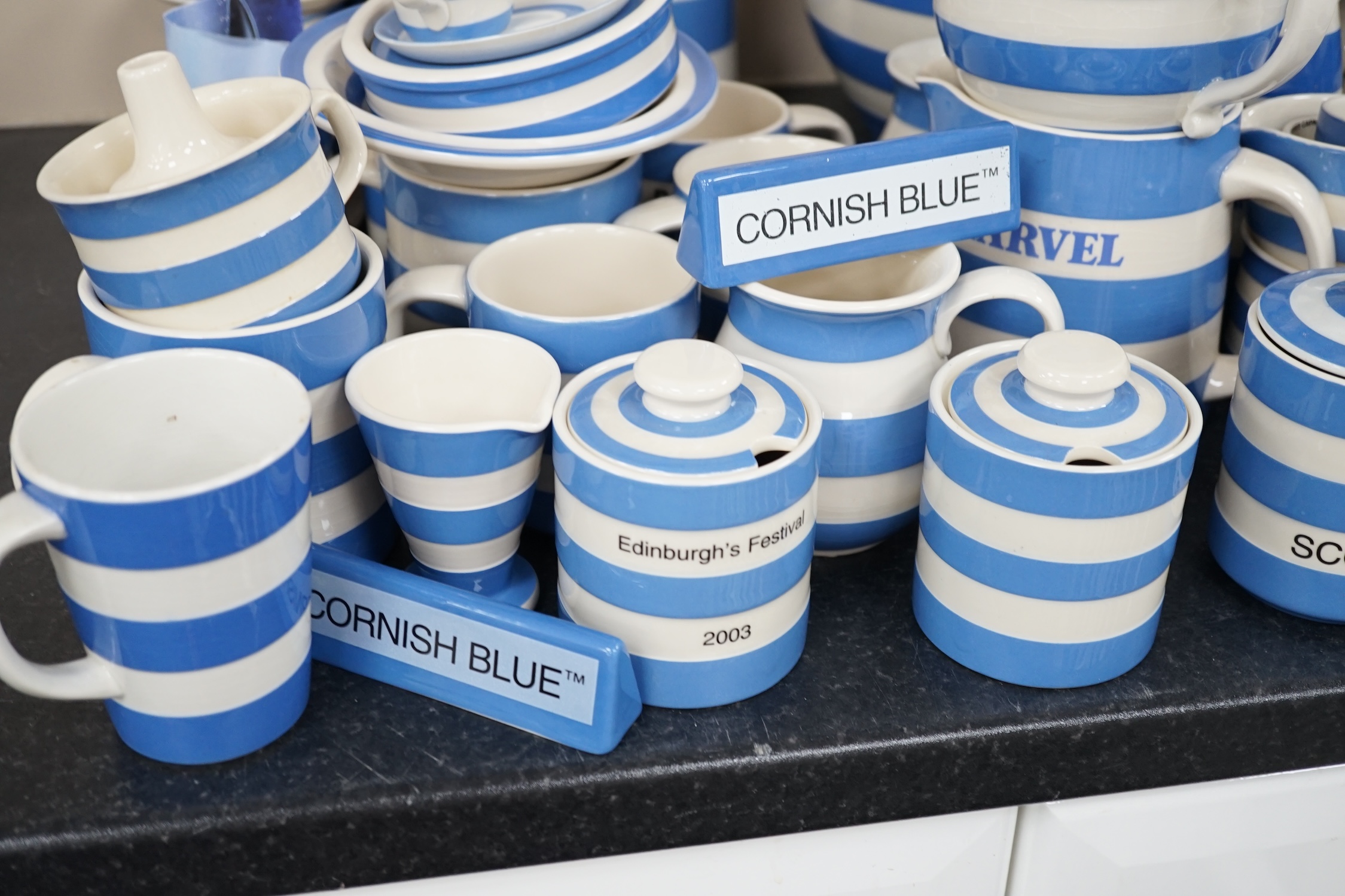 A quantity of modern T.G.Green Cornish Kitchenware, to include lidded storage jars, preserve jars and covers, cups, bowls and jugs, approximately fifty pieces. Condition - fair to good